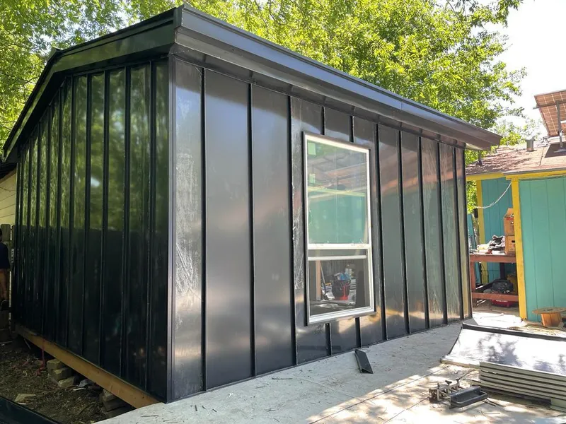 Black standing seam metal wall panels for Roof Inspection in Pass Christian